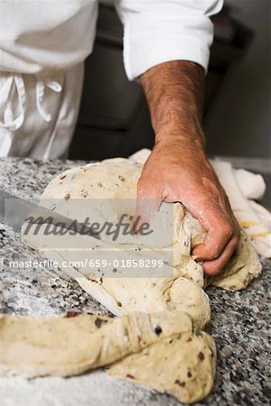 Making olive bread (dividing the dough into portions)