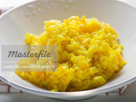 Saffron risotto on white plate