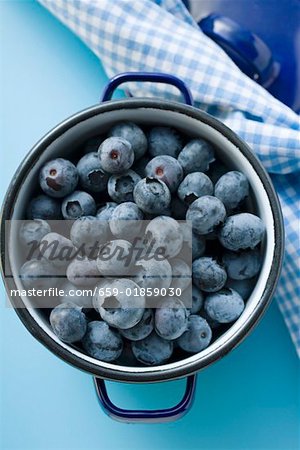 Fresh blueberries in blue pan