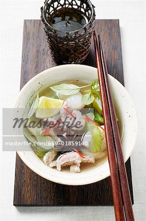 Chicken and lemon grass soup with lime, Thai basil (Asia)