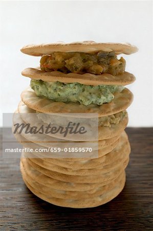 Tower of crackers and three different spreads