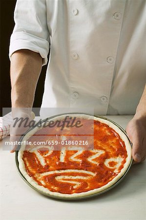 Pizza base spread with tomato sauce, with the word Pizza
