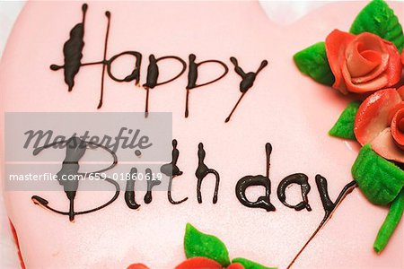 Pink heart-shaped birthday cake with marzipan roses (detail)