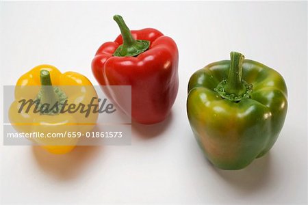 Three peppers (yellow, red, green)