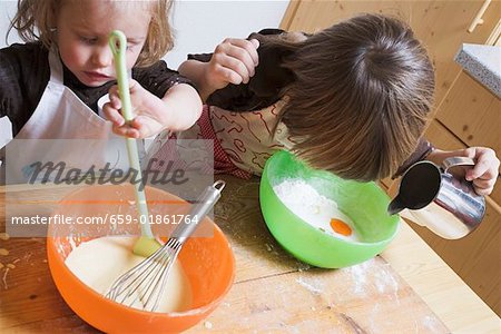 Two children baking