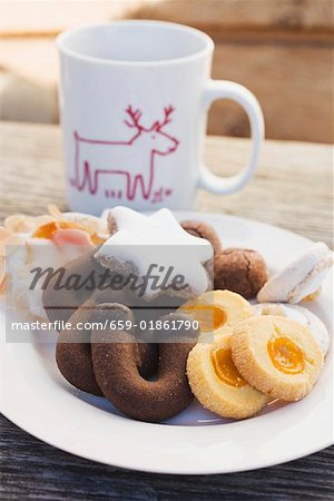 Plate of biscuits in front of Christmassy cup