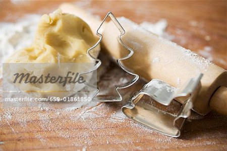 Biscuit dough, biscuit cutters, flour and rolling pin