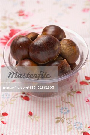 Several chestnuts in glass dish