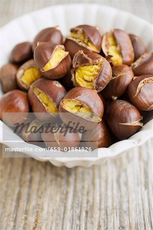 Roasted chestnuts in white bowl