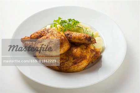 Half a roast chicken with potato salad