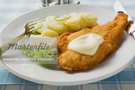 Fish fillet with mayonnaise and potato salad