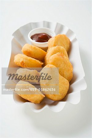 Chicken nuggets with dip in paper dish