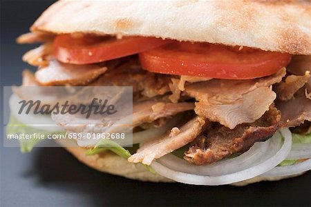 Döner kebab with tomatoes and onions