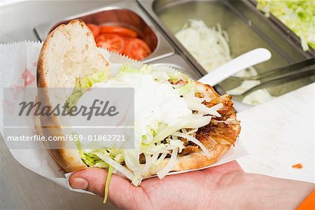 Döner kebab with onions and yoghurt (opened)