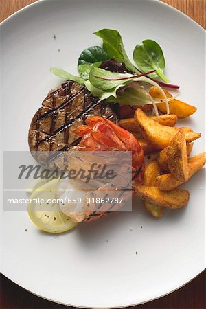 Surf and Turf (beef fillet and prawn) with potato wedges Surf and Turf (beef fillet and prawn) with potato wedges