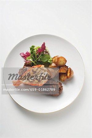 Surf and Turf (beef steak and prawn) with fried potatoes