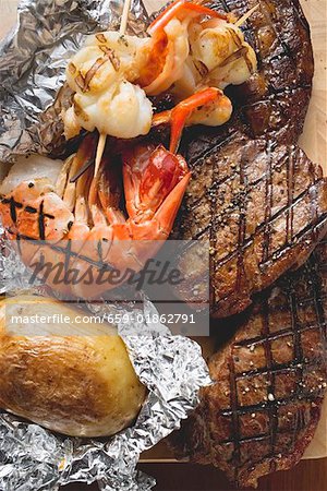 Surf and Turf (beef steaks and prawns) with baked potato