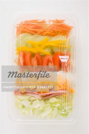 Iceberg lettuce, ham, cheese, egg & vegetables in plastic tray Iceberg lettuce, ham, cheese, egg & vegetables in plastic tray