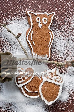 Gingerbread owl on branch, gingerbread acorns beneath it
