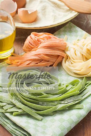 Home-made ribbon pasta, ingredients in background