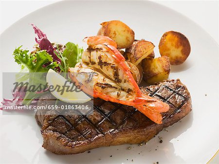 Surf and Turk (prawn and beef steak) with roast potatoes