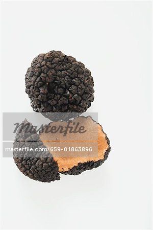 Black truffles, whole and halved