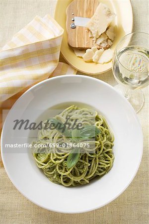 Spaghetti with pesto, Parmesan and glass of white wine