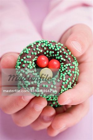 Child's hands holding Easter sweets
