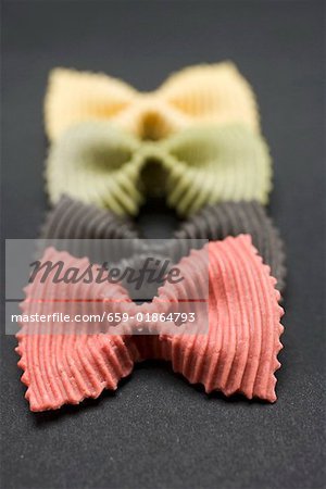 Coloured farfalle in a row