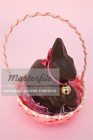 Chocolate Easter Bunny with bow & small bell in Easter basket Chocolate Easter Bunny with bow & small bell in Easter basket
