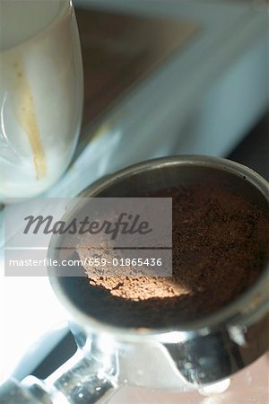 Espresso cup and used coffee grounds