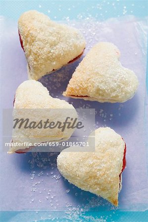 Heart-shaped jam-filled biscuits with sugar