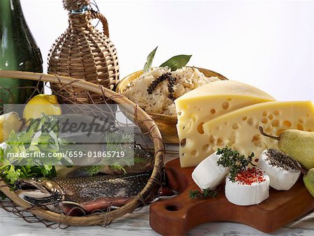 Still life with fish, cheese, pears and sauerkraut