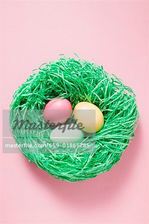 Three sugar eggs in Easter nest