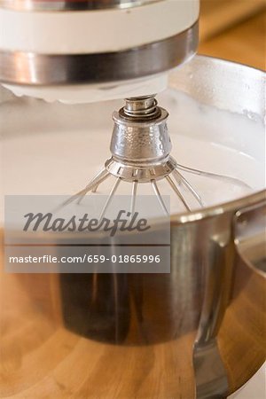 Cream in food mixer with balloon whisk