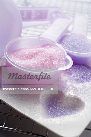 Coloured sugar for decorating biscuits on baking tin