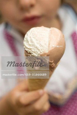 Child holding an ice cream cone