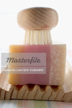 Soap and brush on wooden soap dish