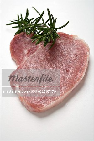 A pork chop with rosemary