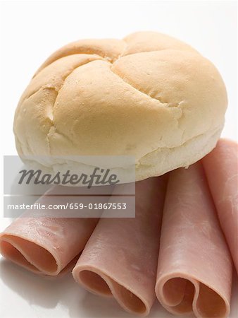 Bread roll on slices of ham