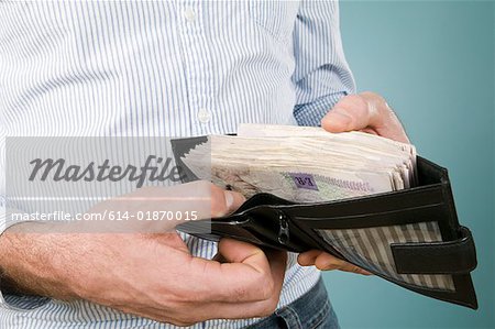 Man with banknotes in his wallet