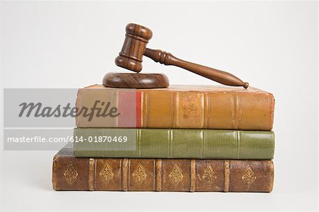 A gavel on top of books