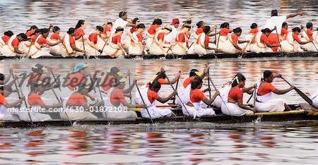 Group of people participating in a snake boat racing, Kerala, India