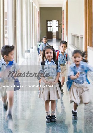 Students running in a corridor
