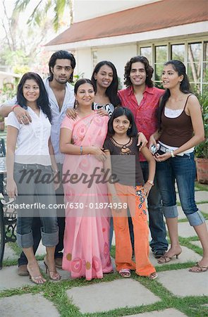 Group of people smiling and standing together