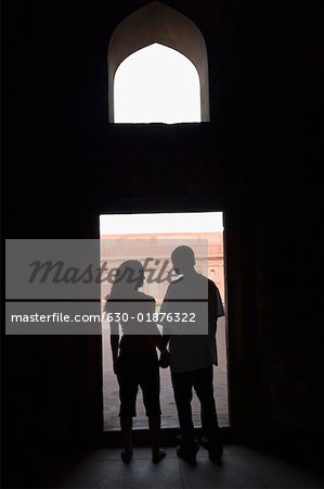 Silhouette of a couple standing together, Taj Mahal, Agra, Uttar Pradesh, India