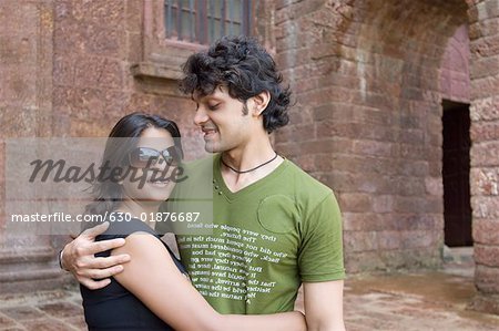 Young couple embracing each other and smiling, Goa, India
