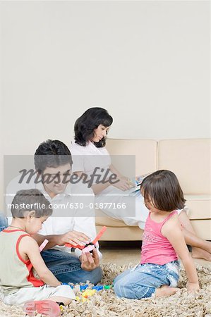 Mid adult man playing with their children