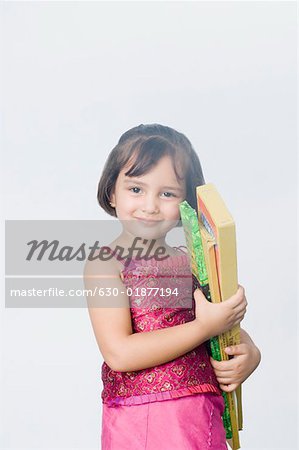 Girl holding crackers and smiling