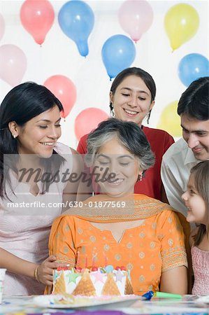 Mature woman celebrating her birthday with her friends